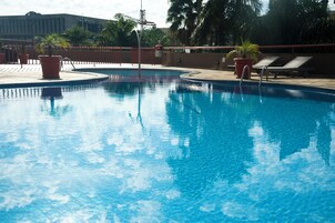 Outdoor pool, open 8:00 AM to 10:00 PM, pool umbrellas, sun loungers