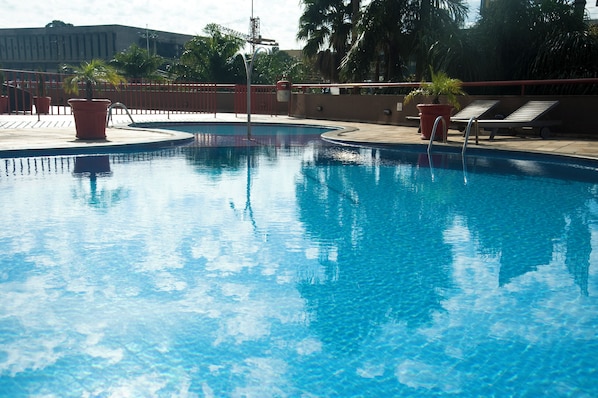 Outdoor pool, open 8:00 AM to 10:00 PM, pool umbrellas, sun loungers