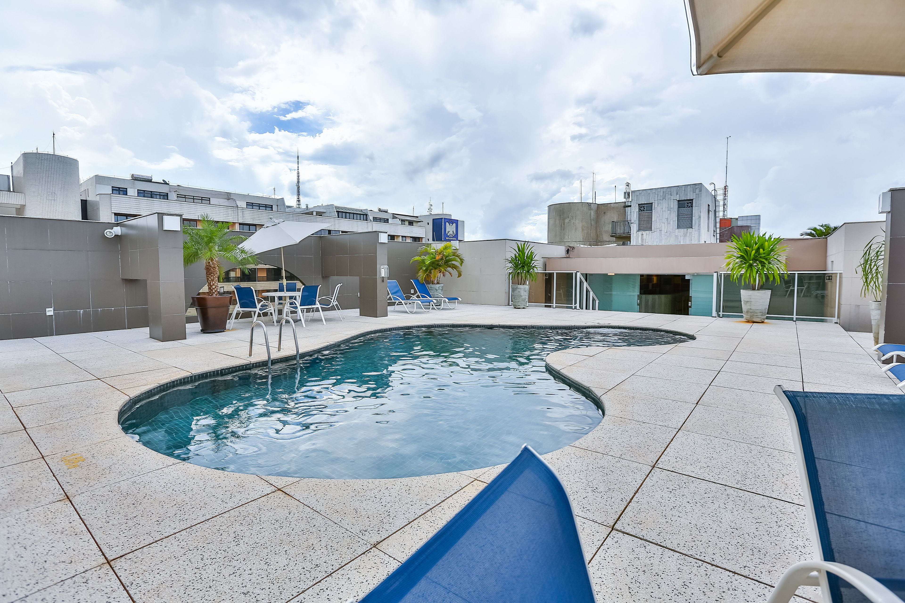 outdoor pool, pool umbrellas, pool loungers