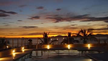 Outdoor pool, open 9:30 AM to 9:00 PM, pool loungers