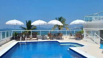 Outdoor pool, open 9:30 AM to 9:00 PM, pool loungers