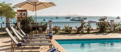 Indoor pool, outdoor pool, open 9:00 AM to 10:00 PM, pool umbrellas