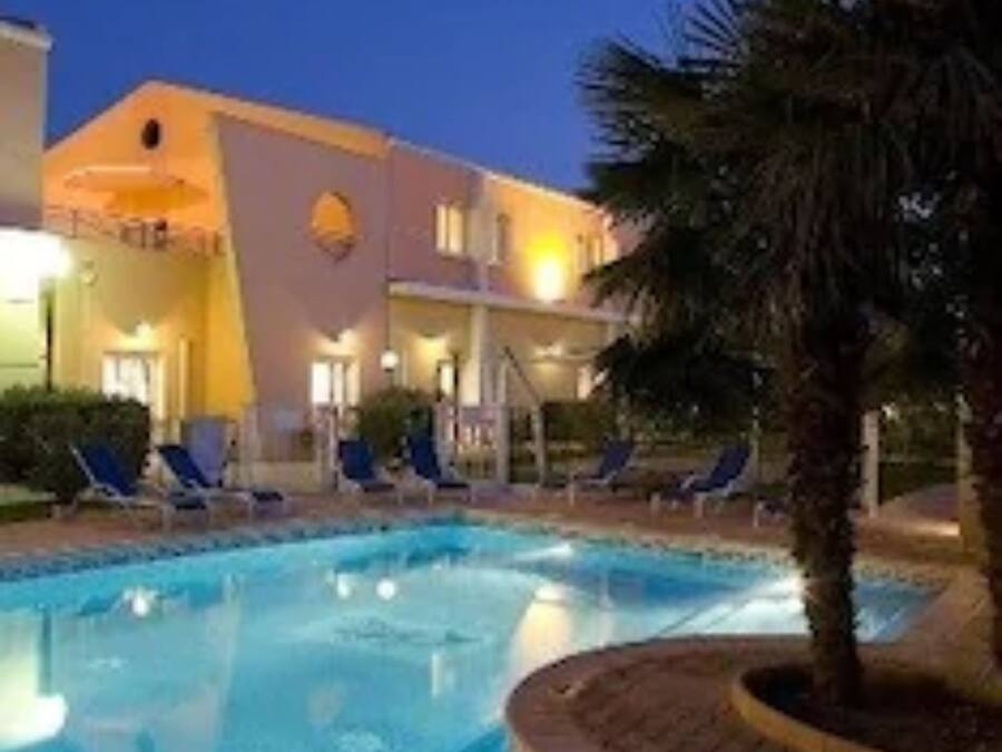 Seasonal outdoor pool, open 9:00 AM to 10:00 PM, pool loungers