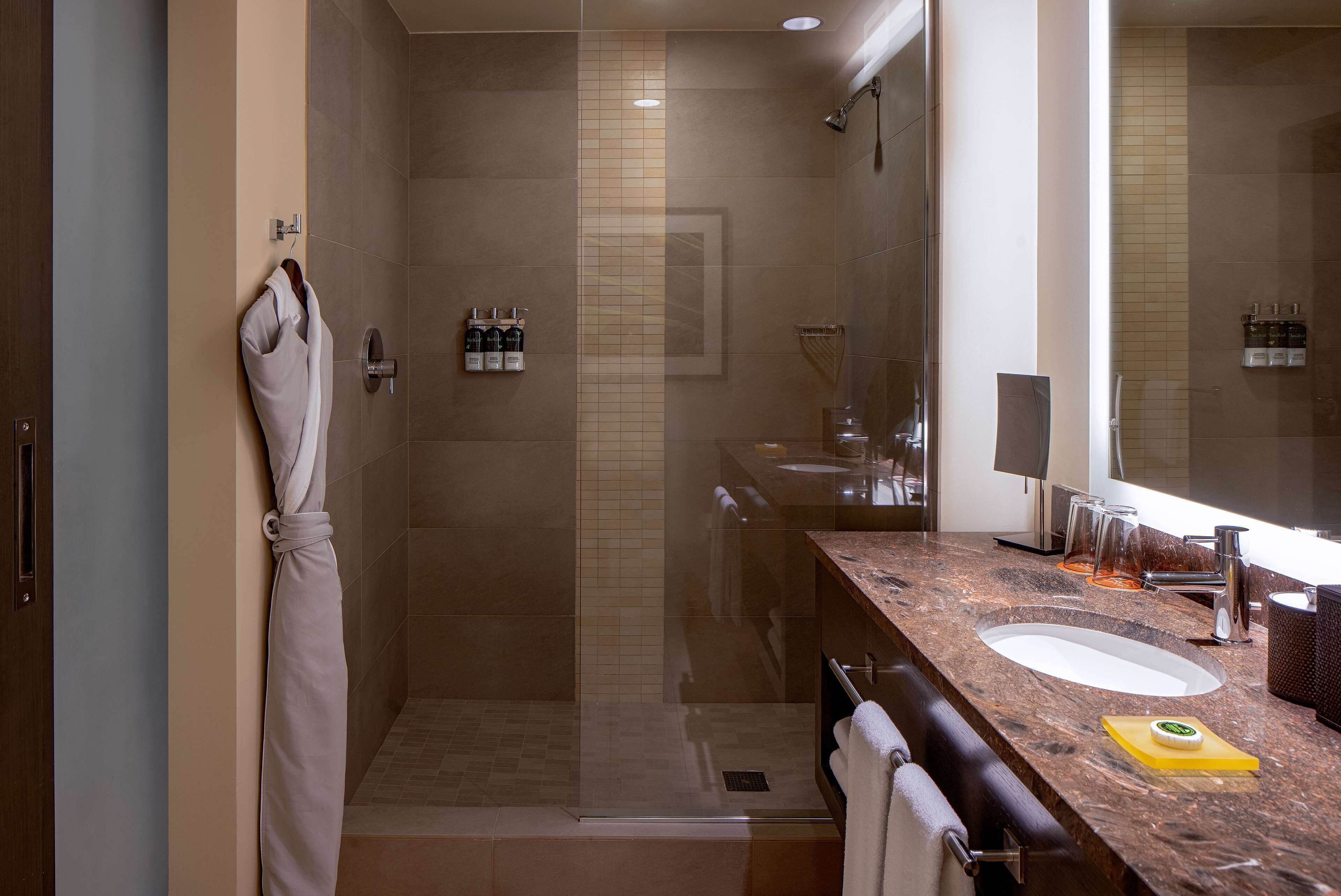 designer toiletries, hair dryer, bathrobes, towels