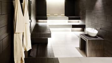 Bathroom features a minimalist design with a white sink and bathtub.