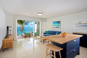 Standard Apartment | Living area | 54-inch flat-screen TV with premium channels, TV, iPod dock - Bleu Emeraude Hotel (Grand Case)
