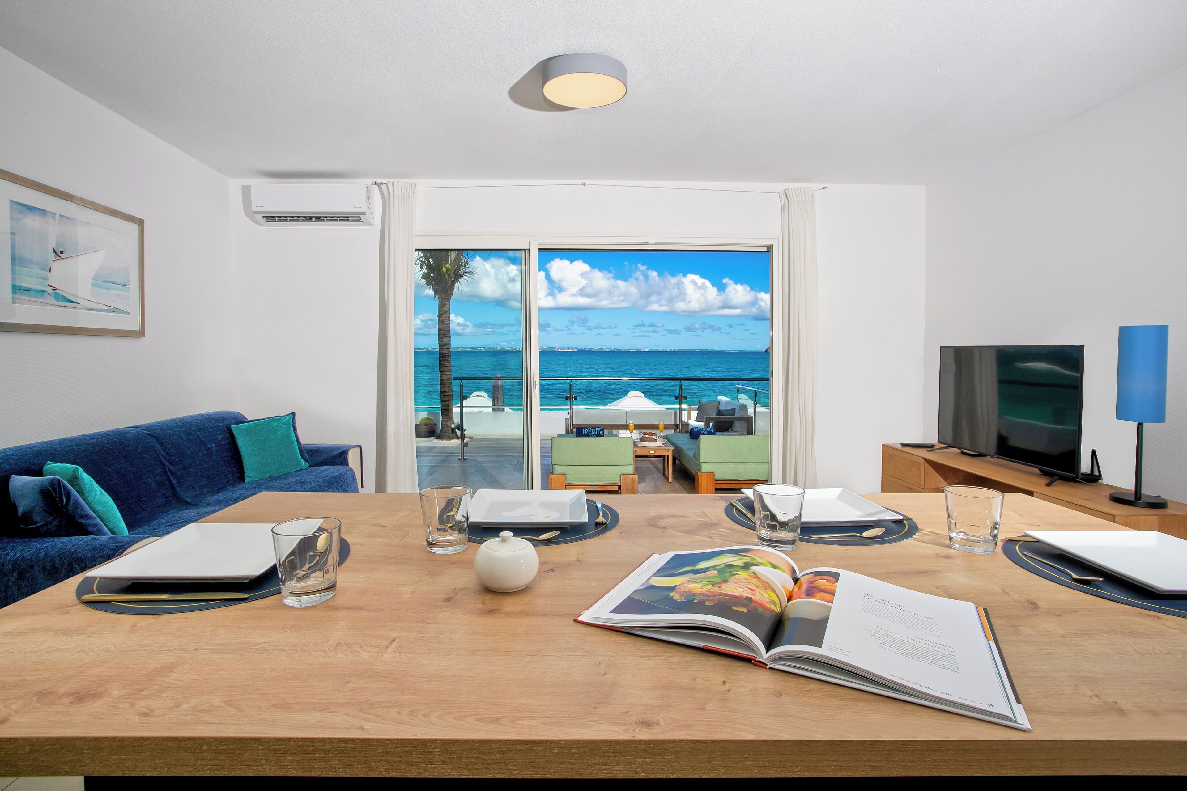 deluxe apartment | living area | 54-inch flat-screen tv with premium tv channels, tv, ipod dock