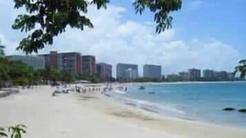 On the beach, white sand, beach towels