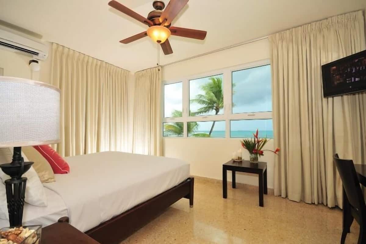 premium room, 1 king bed | in-room safe, desk, iron/ironing board, free wifi