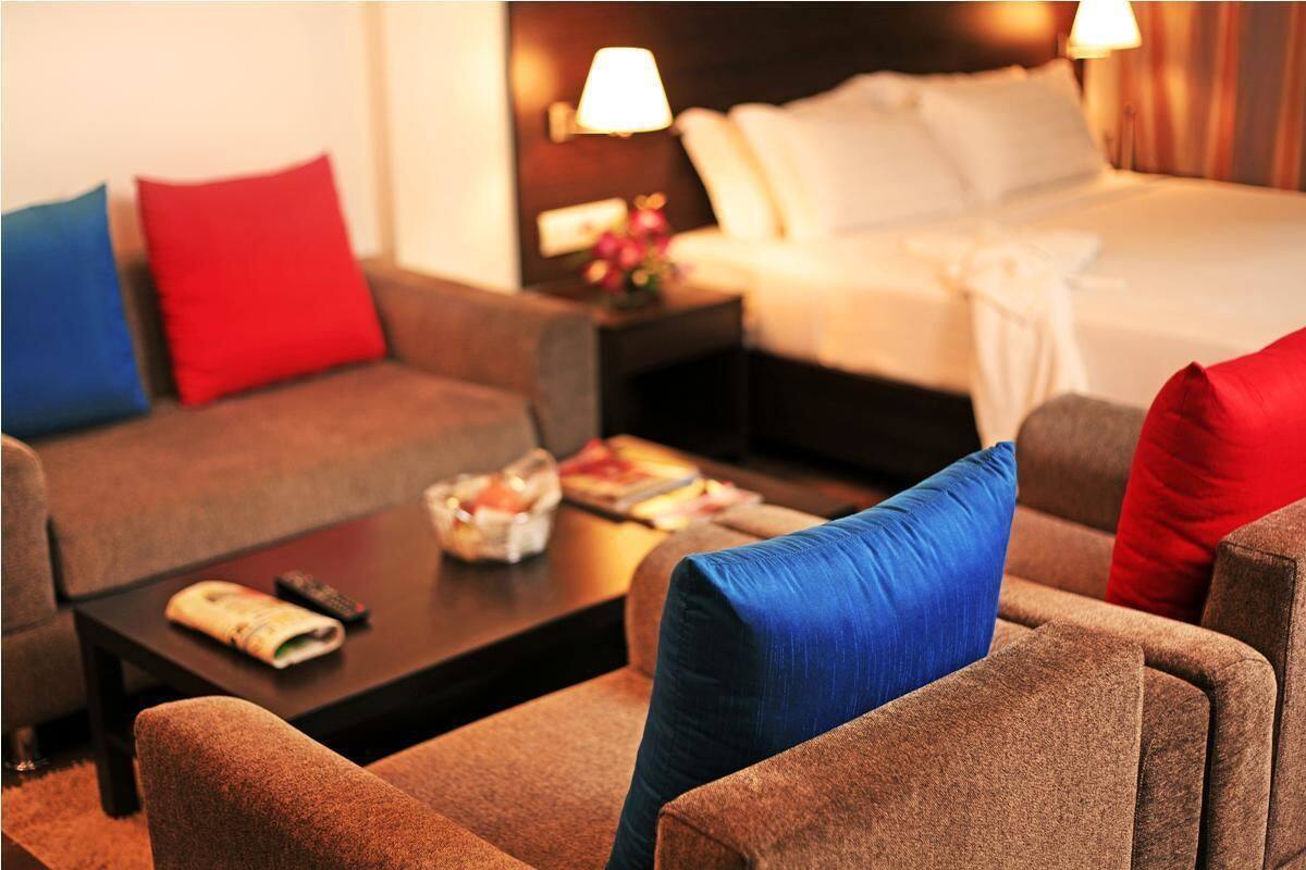 Habitación Deluxe | Ropa de cama de alta calidad y minibar
