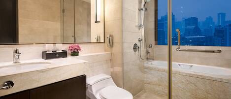 Un baño moderno con inodoro, lavabo y ducha.