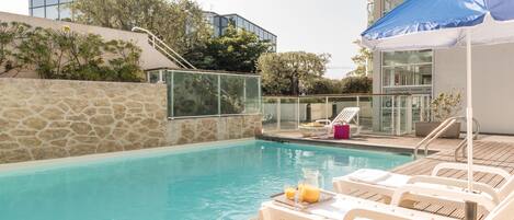 Outdoor pool, pool umbrellas, sun loungers