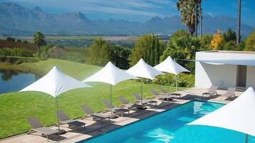 Outdoor pool, pool umbrellas, pool loungers