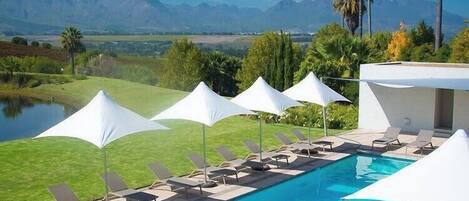 Outdoor pool, pool umbrellas, sun loungers