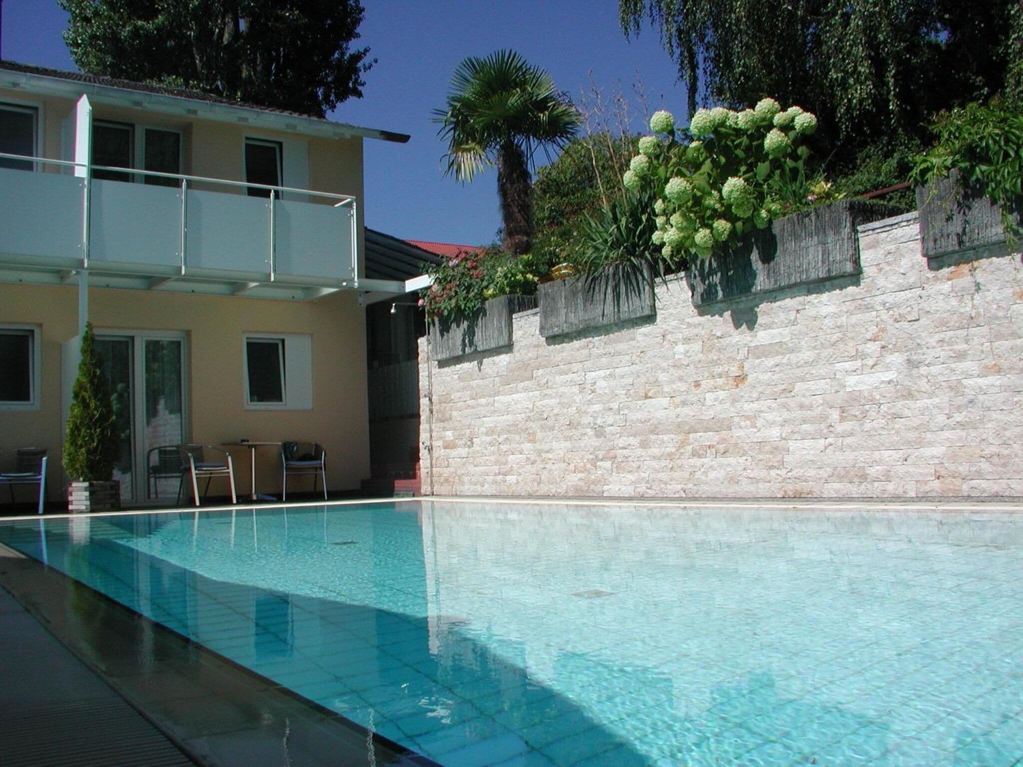 seasonal outdoor pool, open 8:00 am to 8:00 pm, pool loungers
