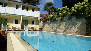 Seasonal outdoor pool, open 8:00 AM to 8:00 PM, sun loungers
