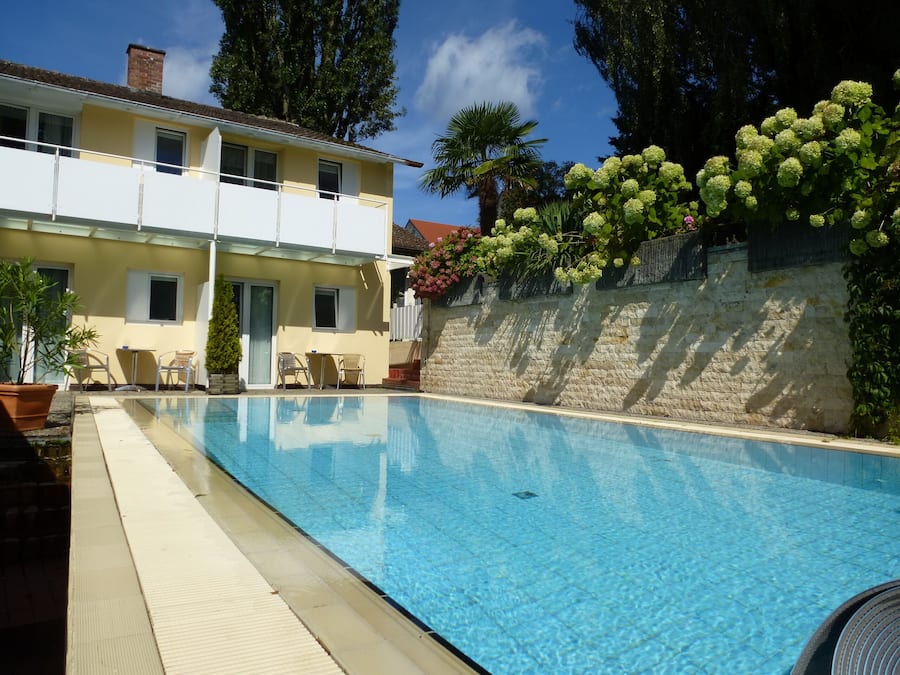 Seasonal outdoor pool, open 8:00 AM to 8:00 PM, pool loungers