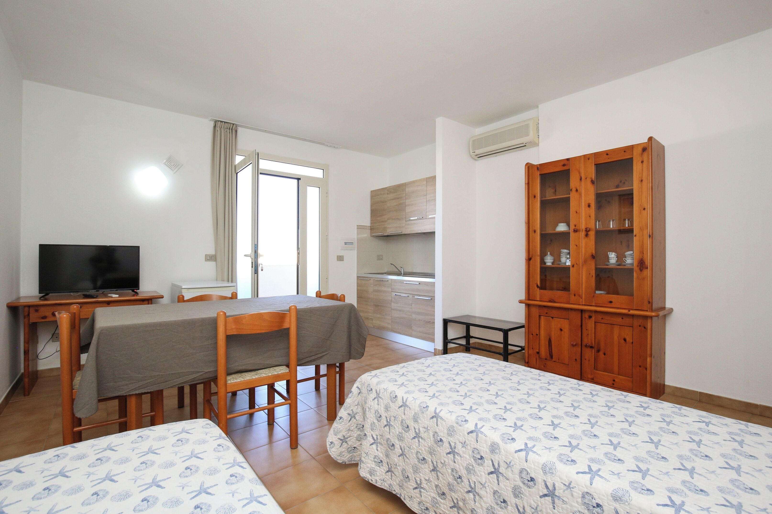 standard apartment | living area | 30-inch flat-screen tv with digital channels, tv