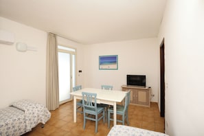 Superior Apartment | Living area | 30-inch flat-screen TV with digital channels, TV