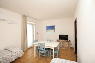 Superior Apartment | Living area | 30-inch flat-screen TV with digital channels, TV
