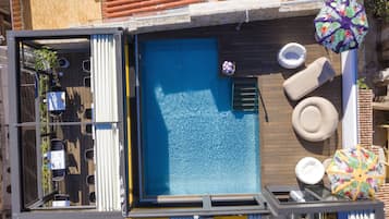 Seasonal outdoor pool, open 8:30 AM to 6:30 PM, pool umbrellas