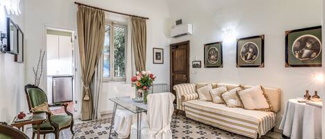 Superior Double or Twin Room | Living area | TV