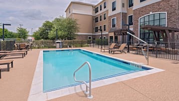 Outdoor pool, open 8:00 AM to 10:00 PM, pool loungers