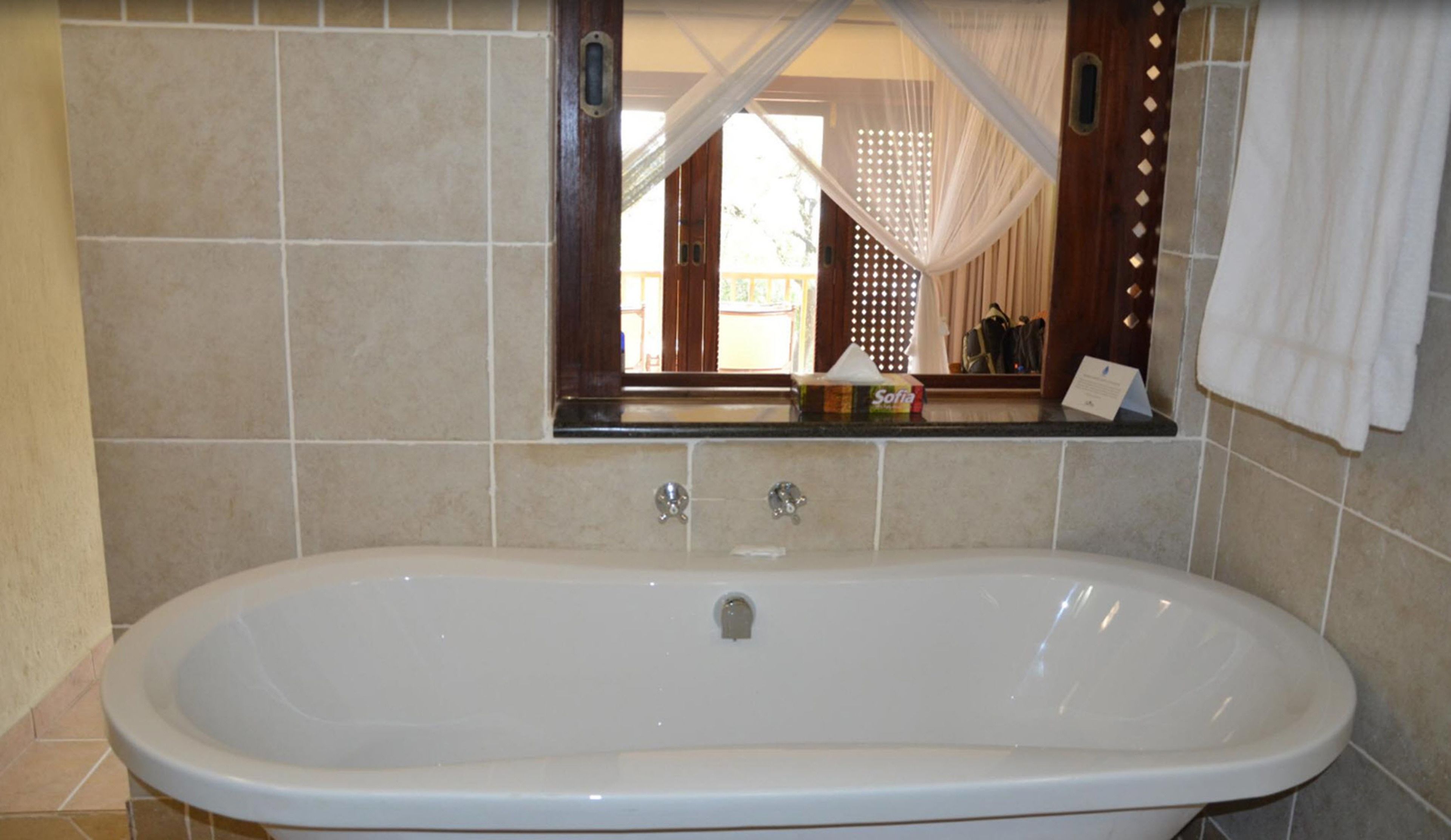 separate bathtub and shower, deep-soaking bathtub, free toiletries