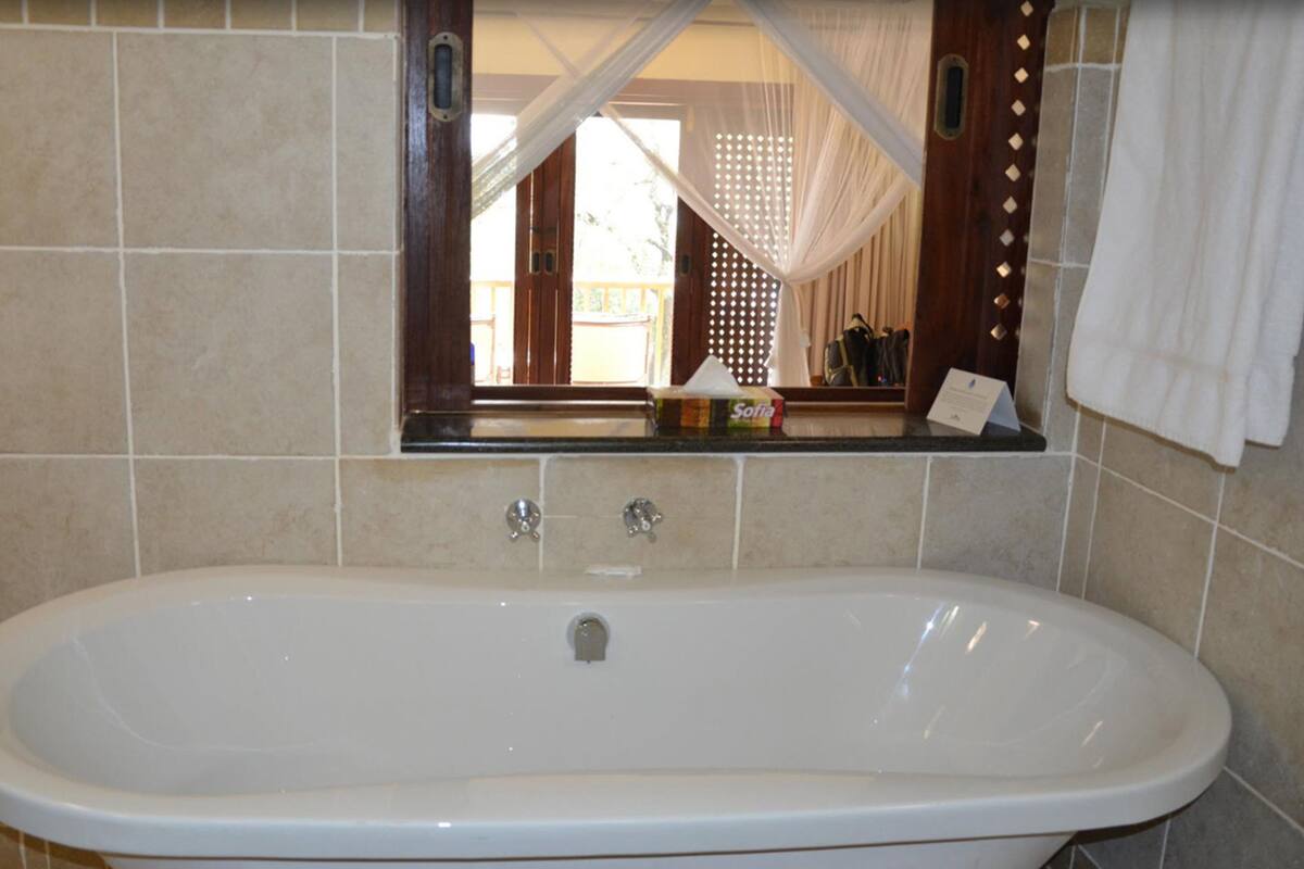 separate bathtub and shower, deep-soaking bathtub, free toiletries