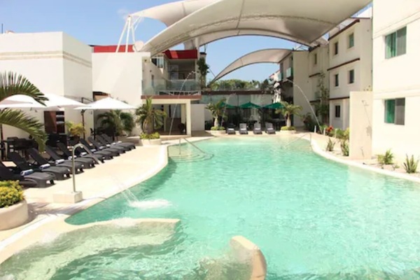 Outdoor pool, open 9 AM to 10 PM, free cabanas, pool umbrellas