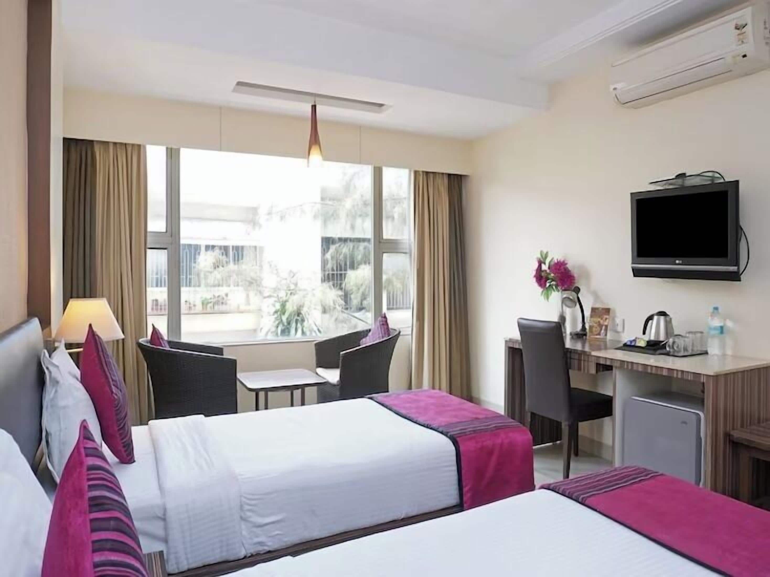 Chambre Exécutive avec lits jumeaux | Minibar, coffres-forts dans les chambres, bureau, chambres insonorisées