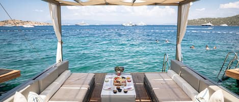 On the beach, sun-loungers, beach umbrellas, beach towels