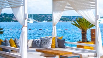 On the beach, sun loungers, beach umbrellas, beach towels