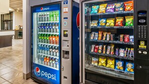 Vending machines with Pepsi and various snacks.