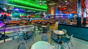 A bar area with seating and a bar counter.
