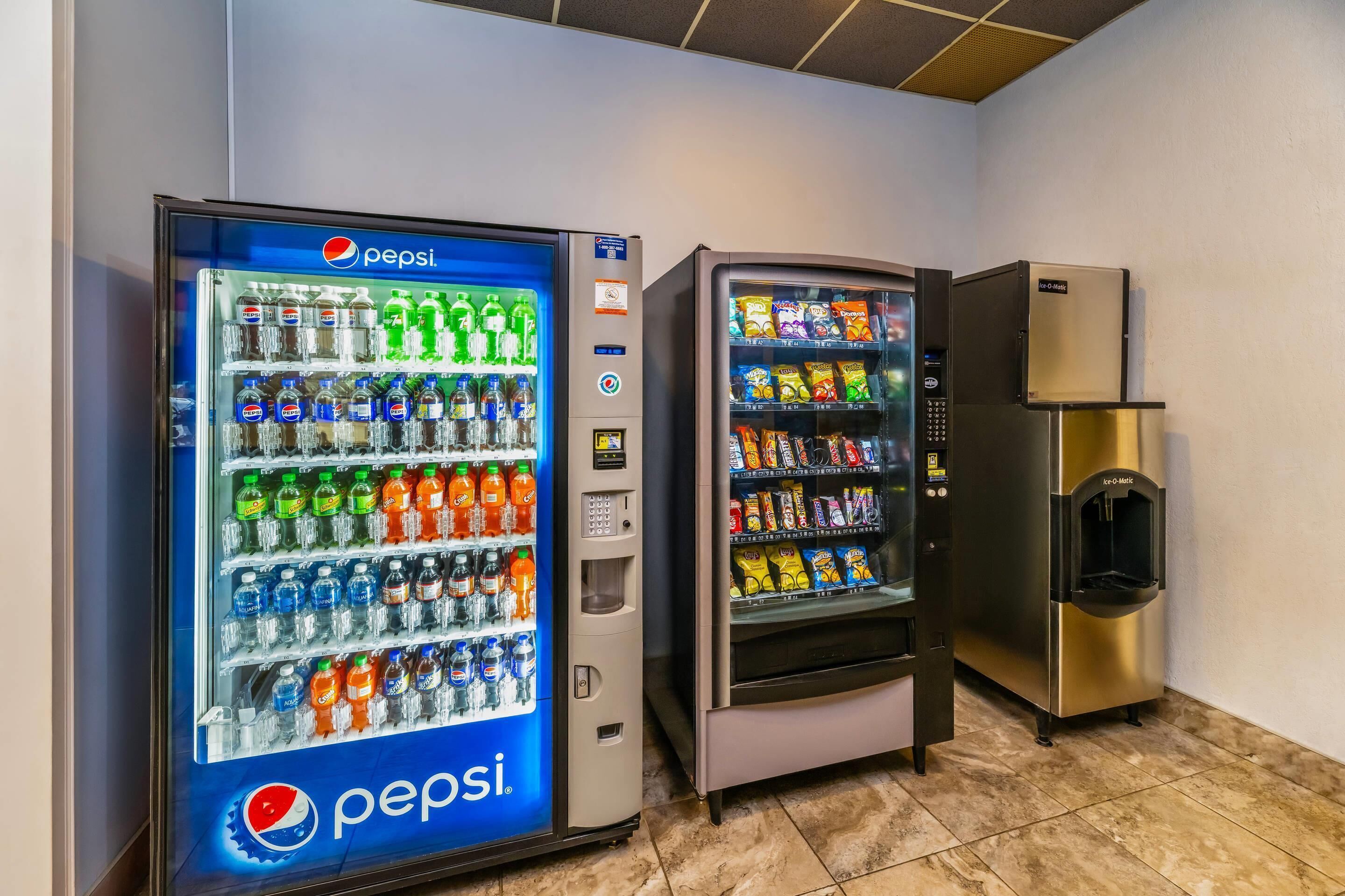 A vending machine area with a Pepsi cooler and an ice dispenser.