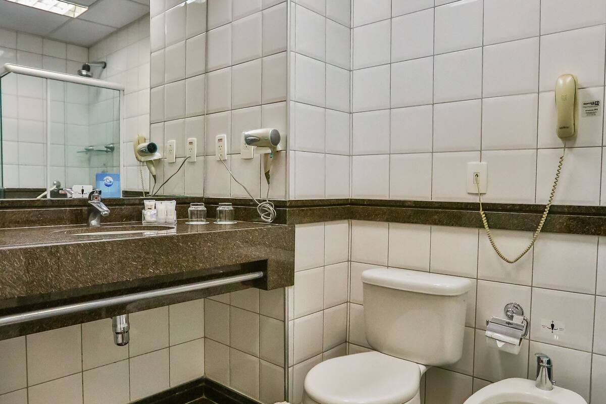 deluxe double room | bathroom | shower, hair dryer, towels