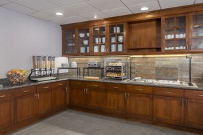 A kitchen with wooden cabinets, a granite countertop, and a built-in refrigerator. - Homewood Suites by Hilton Phoenix North-Happy Valley (Phoenix)