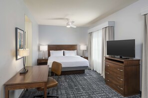 A hotel room with a bed, a desk, a chair, a television, and a dresser. - Homewood Suites by Hilton Phoenix North-Happy Valley (Phoenix)