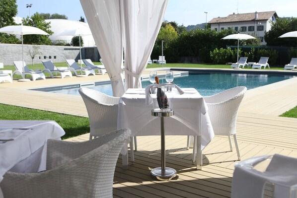 Seasonal outdoor pool, pool umbrellas, pool loungers