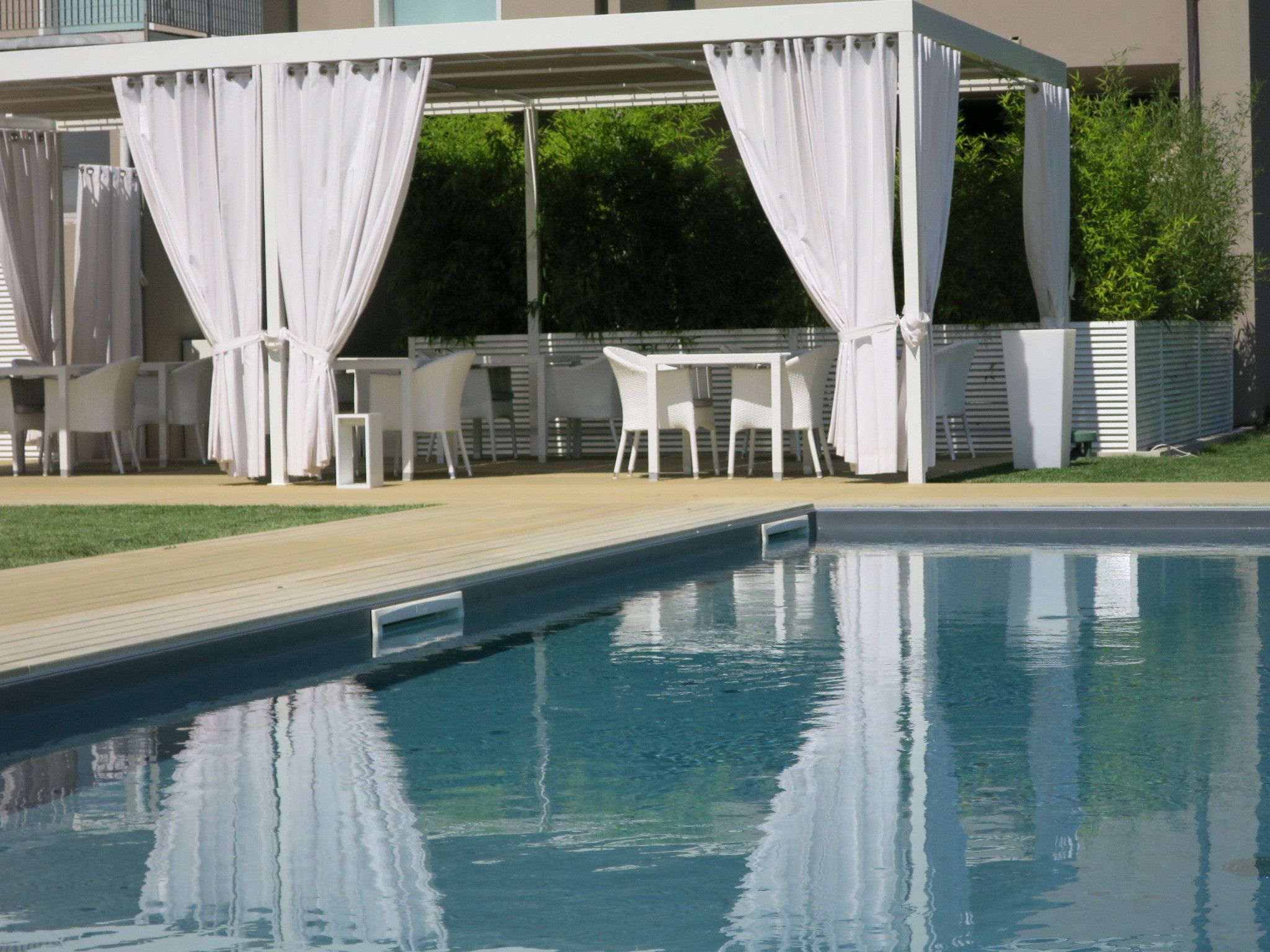 seasonal outdoor pool, pool umbrellas, pool loungers
