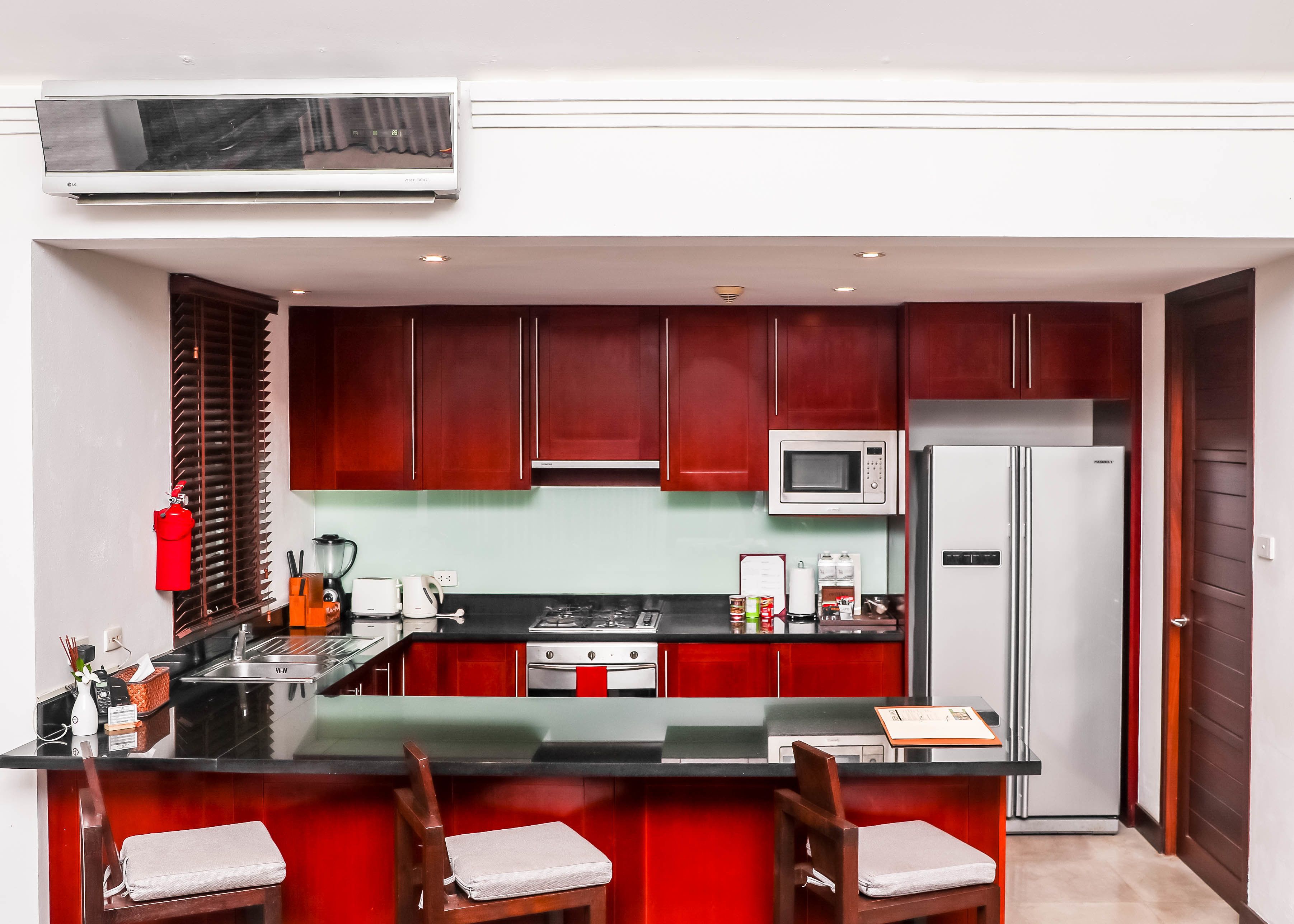 full-sized fridge, microwave, stovetop, dishwasher