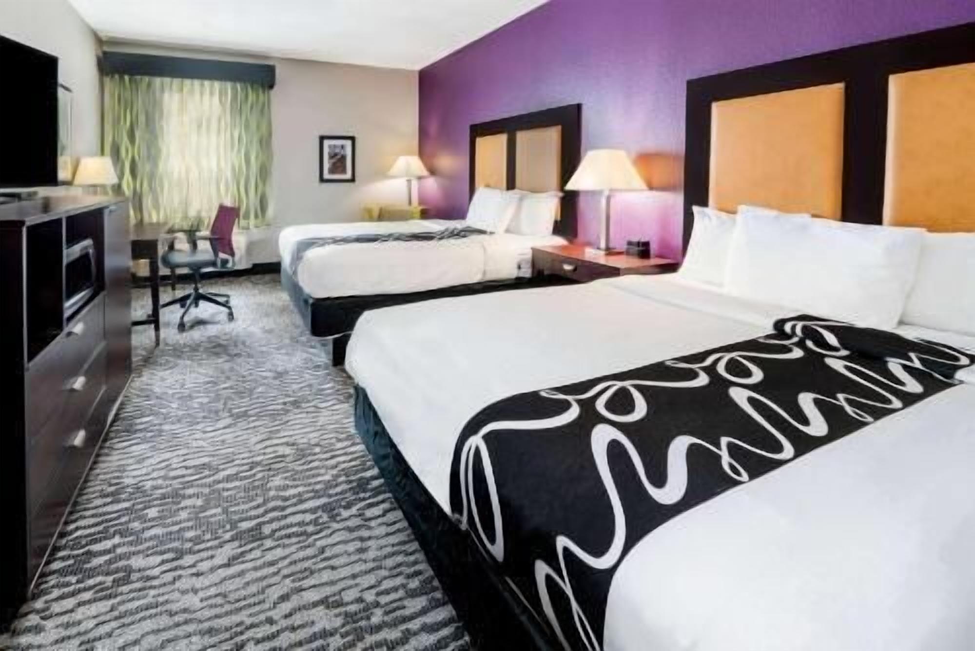 Pillowtop beds, desk, laptop workspace, blackout drapes