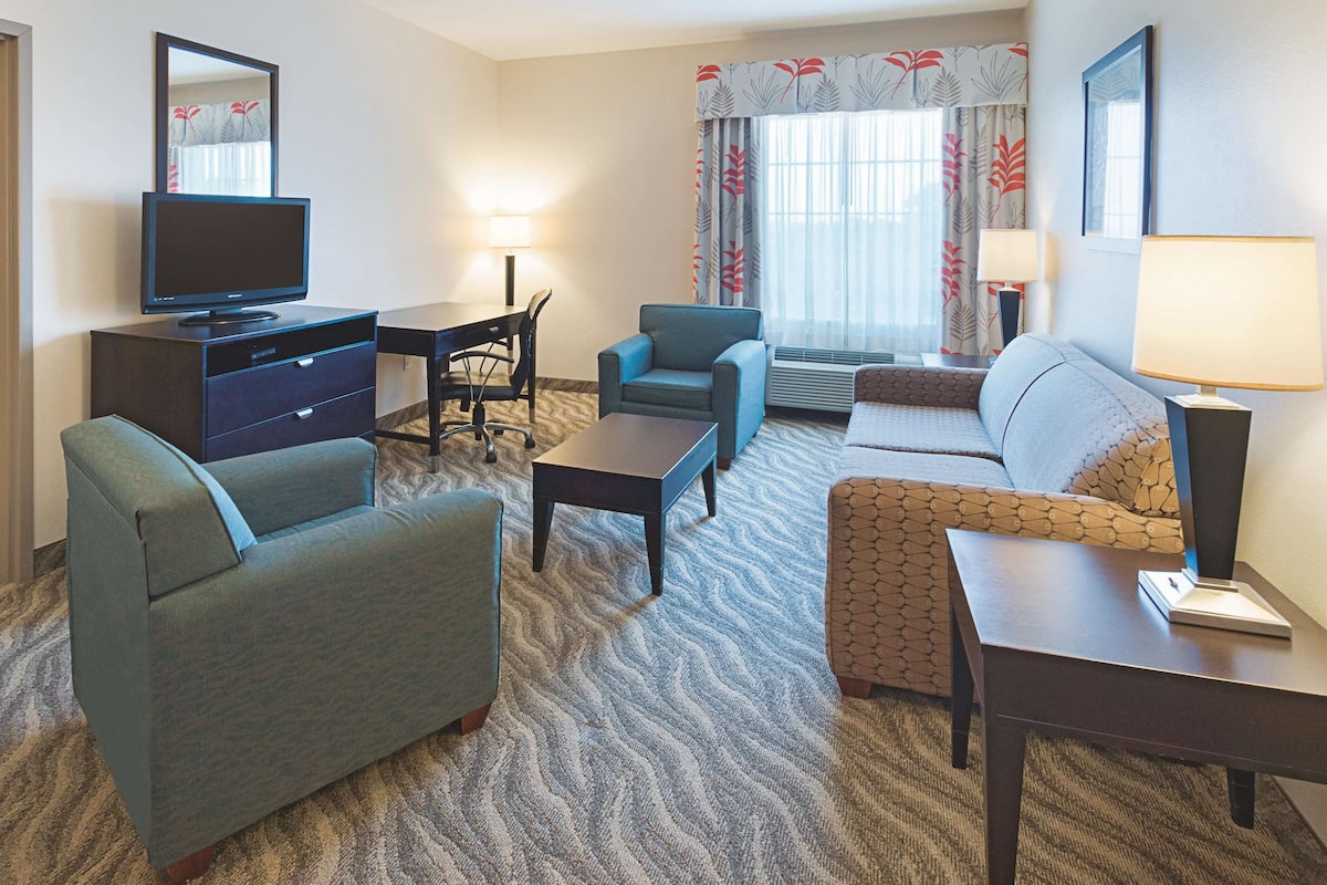 Premium bedding, desk, laptop workspace, blackout curtains