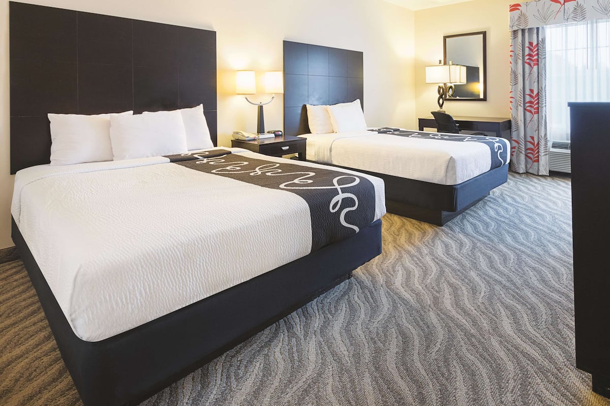 Premium bedding, desk, laptop workspace, blackout curtains