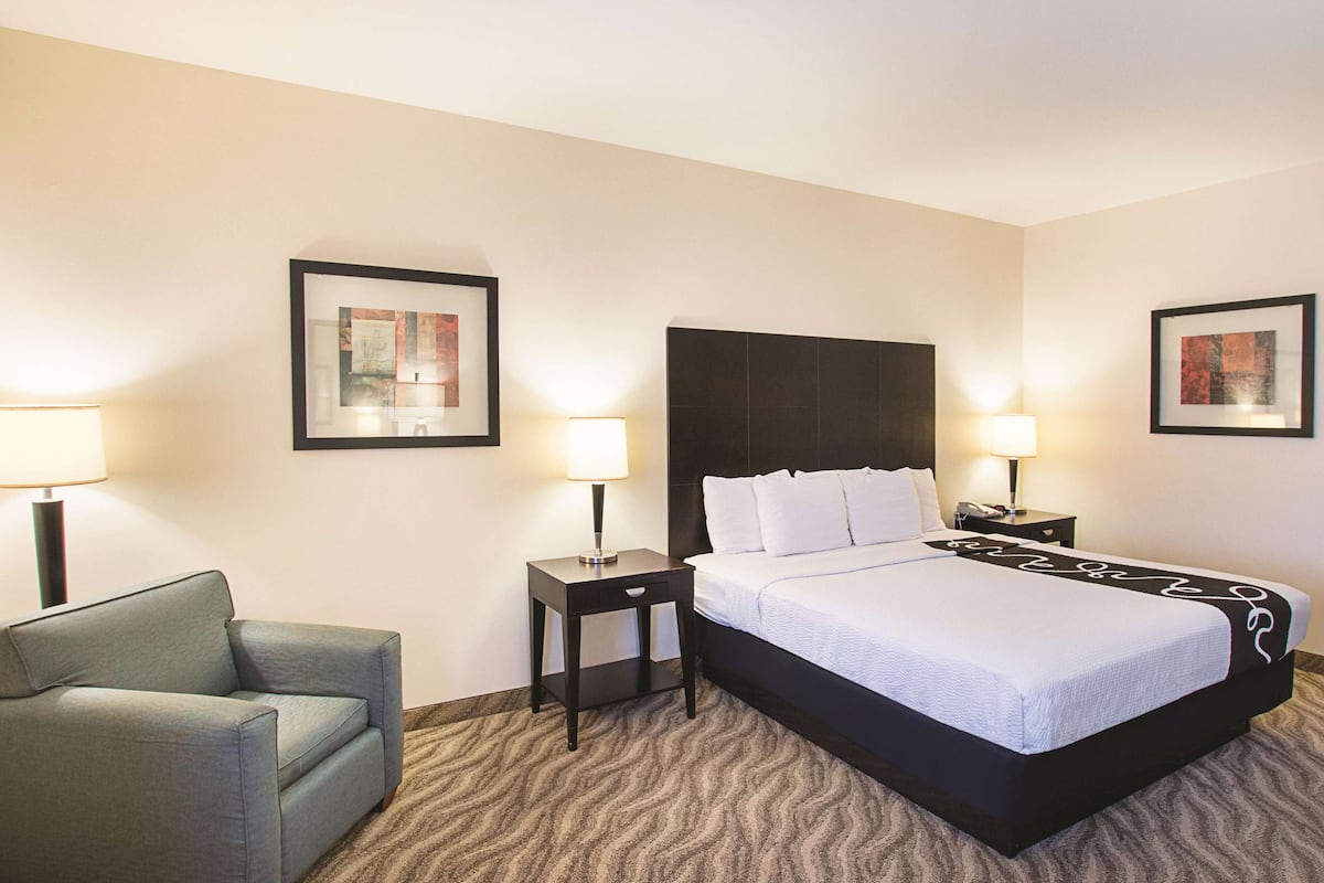 Premium bedding, desk, laptop workspace, blackout curtains