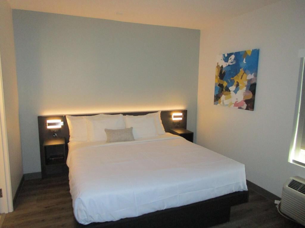 Premium bedding, desk, laptop workspace, iron/ironing board