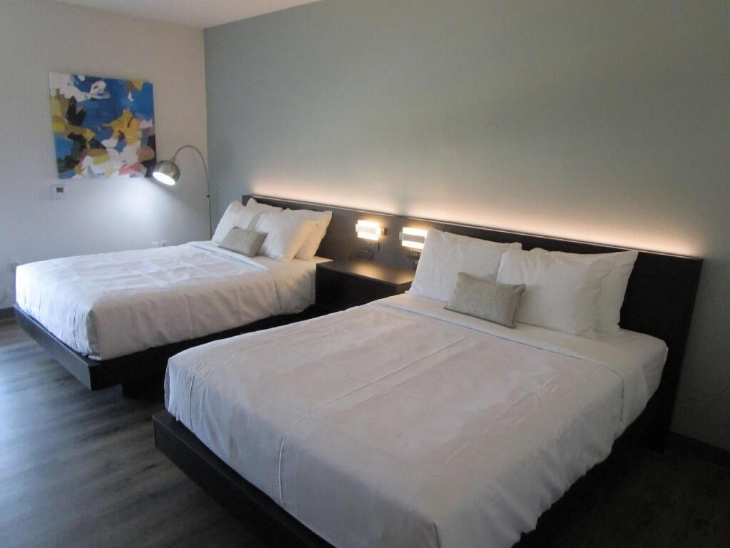 Premium bedding, desk, laptop workspace, iron/ironing board