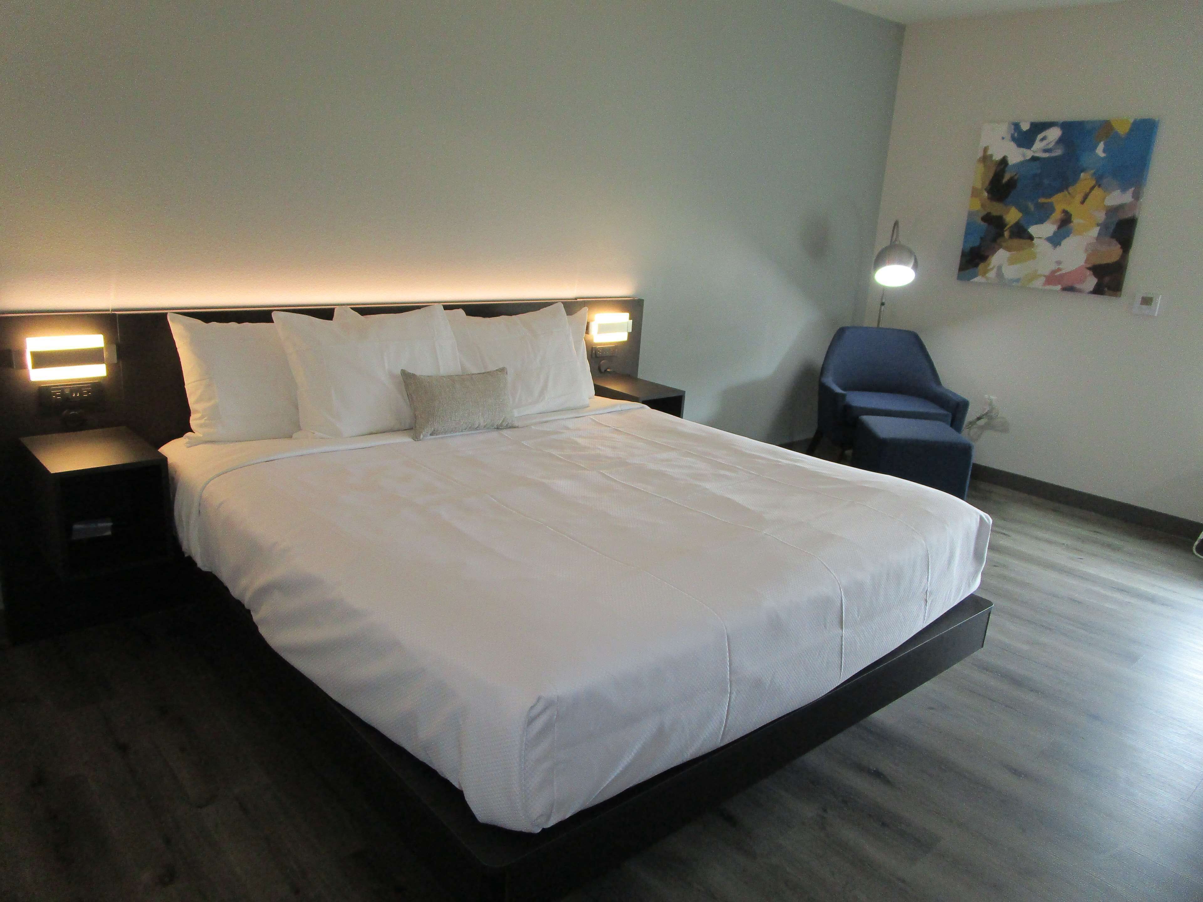 Premium bedding, desk, laptop workspace, iron/ironing board