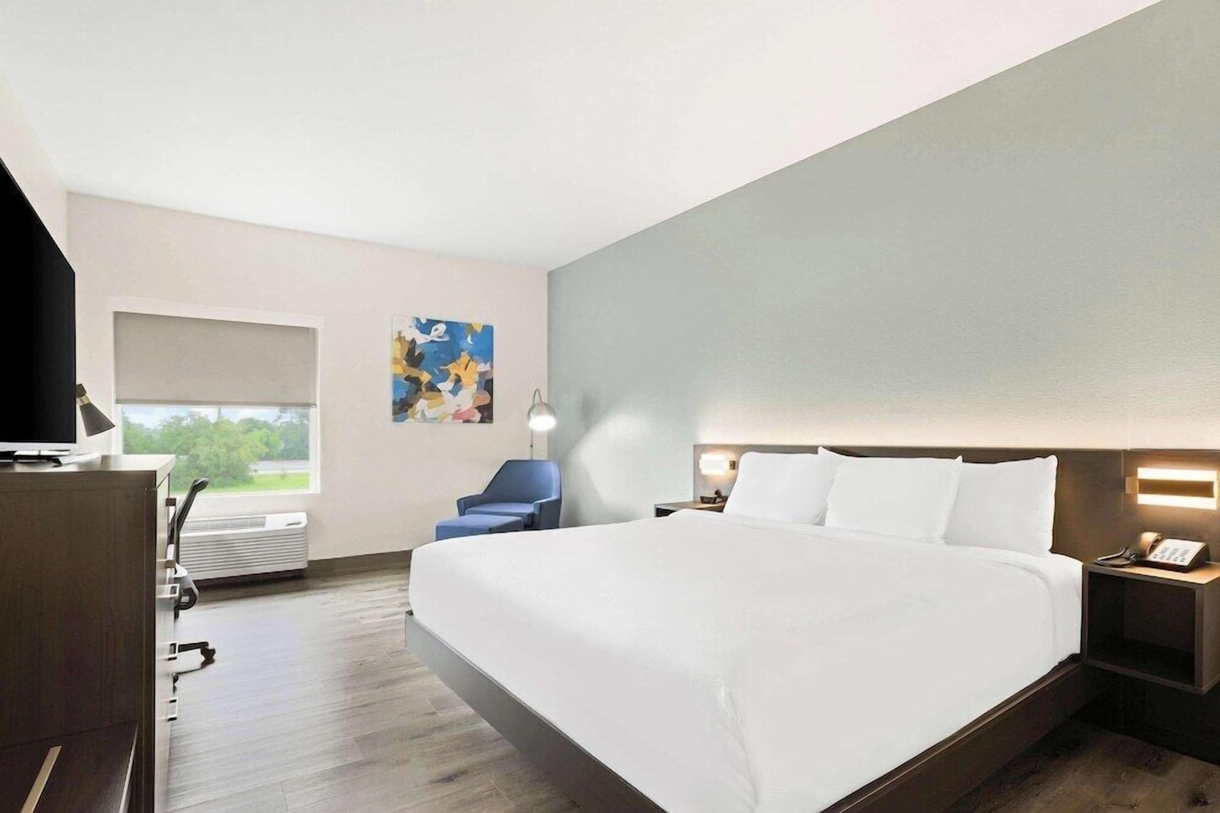 Premium bedding, desk, laptop workspace, iron/ironing board